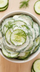 This creamy cucumber salad is a quintessential summer dish that brings a refreshing crunch to your meal. Perfect for picnics or barbecues, it combines crisp cucumbers with a tangy cream dressing
