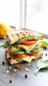 Meet The Ultimate Pesto Grilled Cheese Sandwich, a mouthwatering creation that takes your typical grilled cheese to new heights.