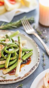 Garlic scapes are the tender flower stalks that grow from garlic plants before they bloom. These green, curly shoots pack a milder garlic flavor and add a unique twist to various dishes.