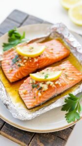 This easy oven baked salmon in foil recipe is a simple and delicious way to prepare fresh salmon fillets or one half of a whole salmon.