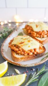 This satisfying dish features baked beans topped with melted cheese served on crispy toast and add eggs sunny side up if you like.