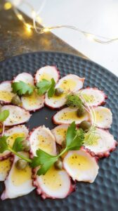Octopus carpaccio is a festive, delicate and flavorful dish that showcases the unique texture and delicious taste of octopus.