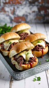 This Slow Cooker French Dip Sandwiches recipe is a simple, but delicious and satisfying meal that requires minimal effort.