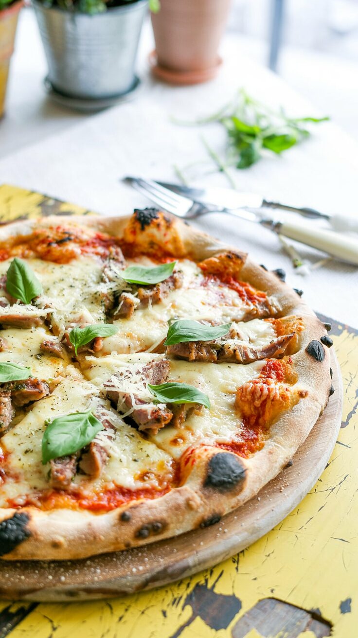 This creamy garlic chicken pizza recipe combines tender chicken with a rich garlic sauce, making it a delicious choice for pizza lovers.