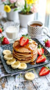 These strawberry banana protein pancakes are a nutritious breakfast option that combines the flavors of ripe bananas and fresh strawberries.